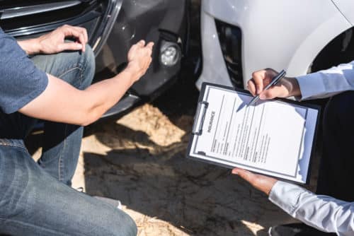 an insurance adjuster going over a car accident claim